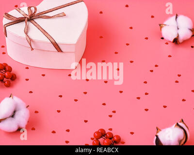White heart gift box for Valentine's Day on pink background. Flatley. St. Valentine day concept. Stock Photo