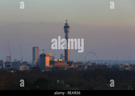 London's skyline is seen from Primrose Hill during a golden winter sunset after a cold and sunny day in the capital. Stock Photo