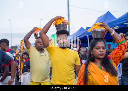 Kuala Lumpur, Malaysia 20 January 2019 - Hindu devotees carry pot of milk on their heads before their pilgrimage to the sacred Batu Caves temple at dawn during the Thaipusam festival. Thaipusam is a key Hindu ceremony that is held each year during the full moon in the tenth month of the Hindu calendar. During Thaipusam festival in South East Asia, Hindu Devotees preparing prayer blessing ceremony by piercing body hooks ‘kavadi’ or milk pots on a four kilometre walk towards Batu Caves temple, to fulfil their vows and offer thanks to the deities. Credit: Gahsoon/Alamy Live News Stock Photo