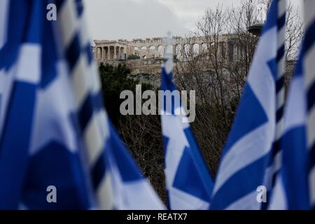 Athens, Greece. 20th Jan, 2019. Acropolis of Athens seen through several Greek flags during the 'Macedonia is Greek' rally, which took place on Syntagma Square.People from all parts of Greece protested against the Prespa agreement between Greece and FYROM, stating that Macedonia is only Greek and demanding a referendum about the agreement. Credit: Giorgos Zachos/SOPA Images/ZUMA Wire/Alamy Live News Stock Photo