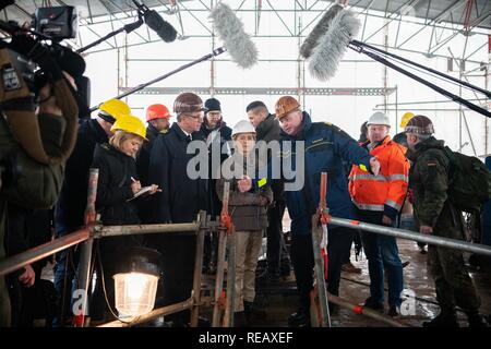 Bremerhaven, Germany. 21st Jan, 2019. Federal Defence Minister Ursula von der Leyen (CDU) is on the ship during her visit with Nils Brandt (3rd from right), commander of the Gorch Fock, and representatives of the press. During her visit, the Minister informed herself about the status of the repair work and spoke with crew members. Von der Leyen wants to decide within a few weeks on the future of the ailing sailing training ship 'Gorch Fock'. Credit: Mohssen Assanimoghaddam/dpa/Alamy Live News Stock Photo