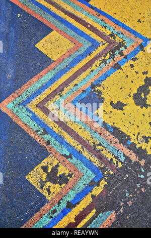 Roadway asphalt colorfully painted with zig-zag lines to indicate a no-parking area on General Luna street adjoining to Plazuela Santa Isabel. Intramu Stock Photo