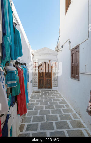 Lindos, Greece. 05/28/2018. Shopping in alley in Lindos Town. Every inch of free wall in old town is used as a display of items for sale to tourists. Stock Photo