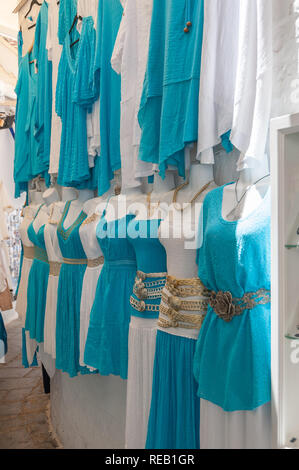 Lindos, Greece. 05/28/2018. Shopping in alley in Lindos Town. Every inch of free wall is old town is used as a display of items for sale to tourists.  Stock Photo