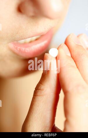 Young woman taking a tablet Stock Photo