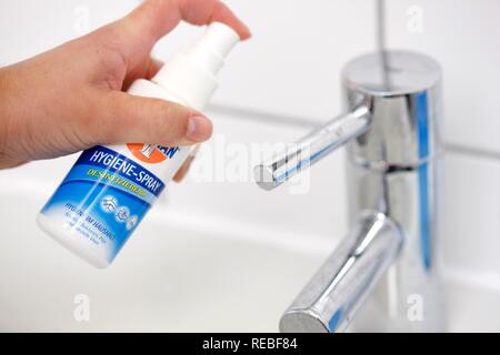Hand basin being disinfected with a disinfectant Stock Photo