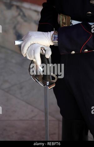 Soldier guarding the Casa Rosada, presidential palace on the eastern side of the Plaza de Mayo Square, white gloves in detail Stock Photo