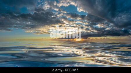 Sunset or sunrise reflected on smooth water Stock Photo