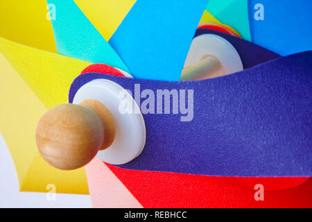 Multicolored pinwheel windmill toy macro detail. Summer and childhood Stock Photo