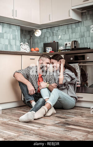 Stylish loving couple wearing jeans feeling happy being together Stock Photo