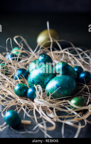 Easter background with painted Easter eggs in vintage style over dark background Stock Photo