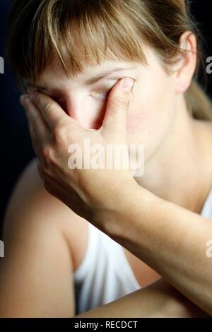 Young woman having a headache Stock Photo