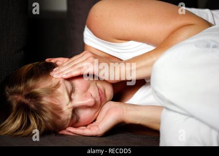 Young woman having a headache Stock Photo