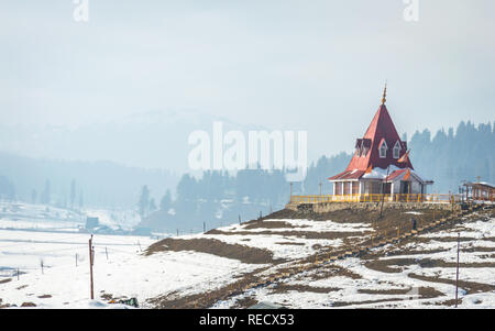 A hindu temple in a snowy landscape at Gulmarg in Kashmir Stock Photo