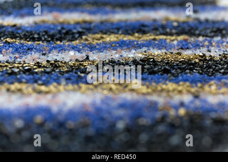 Layered blur sand pattern. Marble style background. Blue and gold powder defocused texture. Stock Photo