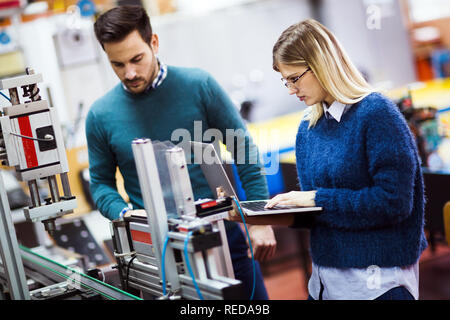 Young students of electronics working on project Stock Photo