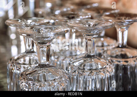 Close up of group of drinking glasses turned upside down. Stock Photo