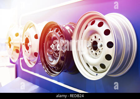 Metal stamped rims of wheels for cars in the shop Stock Photo