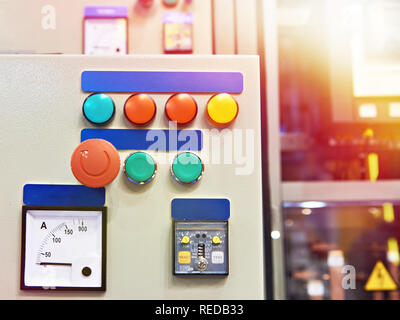 Equipment and systems control stand in industrial plant with different buttons Stock Photo