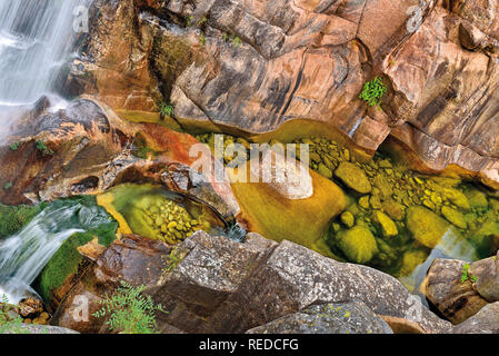 Wild canyon with waterfalls, huge rocks and cristaline water Stock Photo