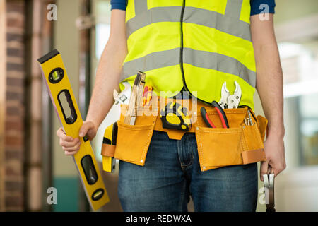Detail Of Construction Worker On Building Site Wearing Tool Belt Stock Photo