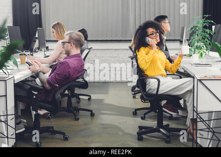 multiethnic group of professional business people working with digital devices in office Stock Photo