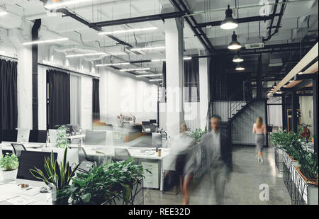 modern office interior with blurred business people in motion Stock Photo