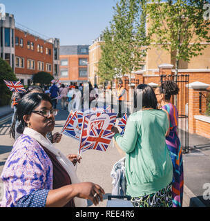 WINDSOR, UNITED KINGDOM - MAY 19, 2018: Womens with flags at royal wedding marriage celebration of Prince Harry, Duke of Sussex and the Duchess of Sussex Meghan Markle happy romantic best atmosphere Stock Photo