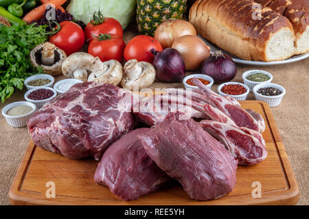 Raw marinated lamb chops, steak, ribs. Stock Photo