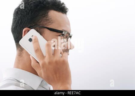 side view. businessman talking on his smartphone Stock Photo