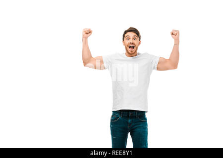 excited young man showing muscles and smiling at camera isolated on white Stock Photo