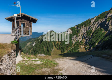 Unusually with overhang built small weather and observation station with position near the mountain station of the Tegelbergbahn in Bavaria with blue  Stock Photo