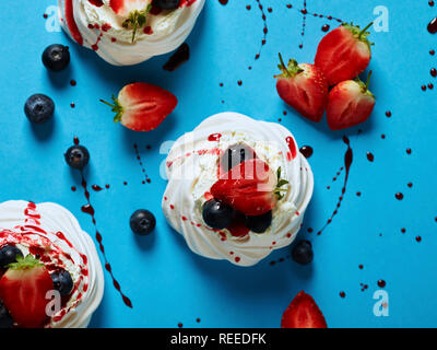 Fruit topped meringues Stock Photo