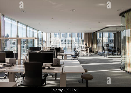 Open plan office interior with window walls and glazed think tanks. Swiss Re Office headquarters, Zurich, Switzerland. Architect: Diener & Diener, 201 Stock Photo