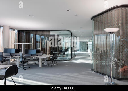 Open plan office with glazed think tanks. Swiss Re Office headquarters, Zurich, Switzerland. Architect: Diener & Diener, 2017. Stock Photo