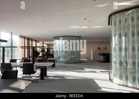 Open plan office with glazed think tanks. Swiss Re Office headquarters, Zurich, Switzerland. Architect: Diener & Diener, 2017. Stock Photo