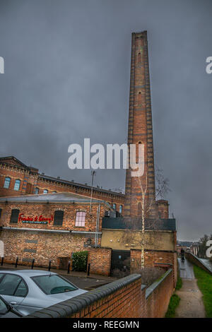 Portrait shot of refurbished, Grade II listed Slingfield Mill in Kidderminster (now Frankie & Benny's). Historic landmark by canal, bleak Jan morning. Stock Photo