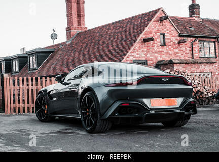 Aston Martin Vantage rear three quarter view outside house Stock Photo