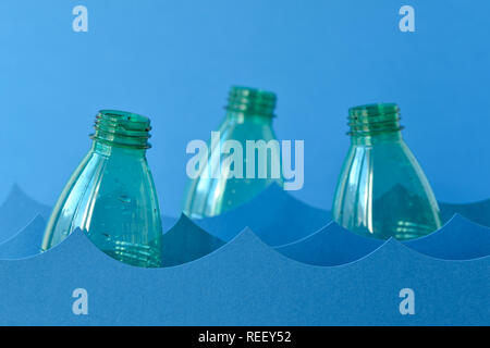 Plastic bottles floating on water - Sea pollution concept Stock Photo