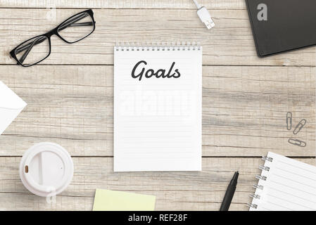 Notepad with goals text in header. Empty page for goals list. Top view, flat lay, hero, header image. Stock Photo