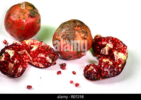 Juicy pomegranate on white background Stock Photo