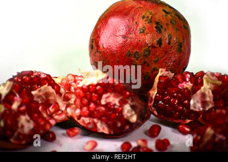 Juicy pomegranate on white background Stock Photo