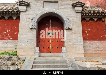 Dengfeng, China - October 17, 2018: An old style stone door inside Shaolin Temple songshan dengfeng city henan province China. Stock Photo