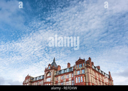 Altocumulus clouds above the Headland Hotel in Newquay Cornwall. Stock Photo