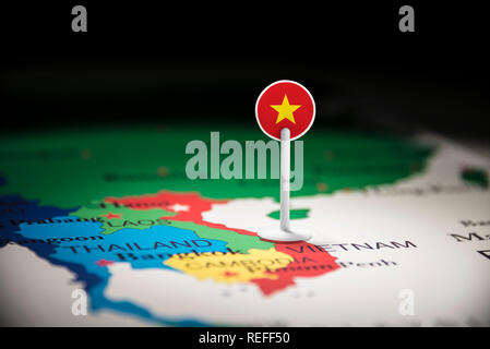 Vietnam marked with a flag on the map Stock Photo - Alamy