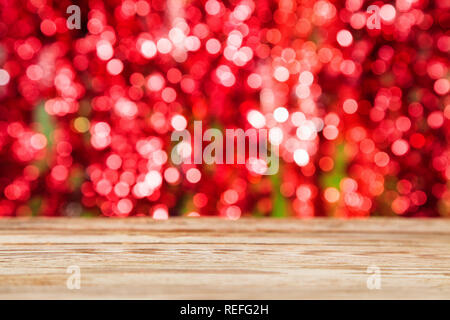 Empty wooden table over festive bokeh background. Christmas, Wedding, Valentines day holiday concept. Stock Photo