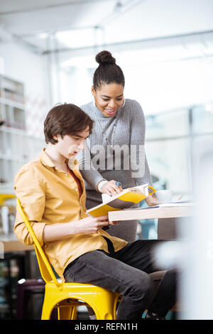 Students helping each other to get higher grade Stock Photo