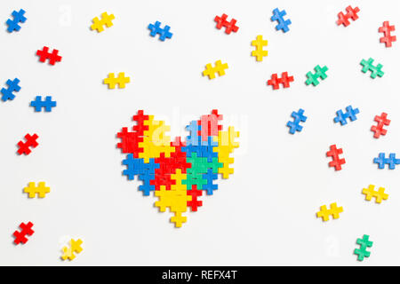 Top view on heart made of colorful plastic construction bricks on white background Stock Photo