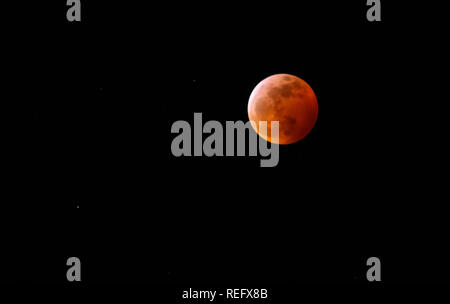 Red (blood) moon and stars in the sky during total moon eclipse January 20, 2019 Stock Photo