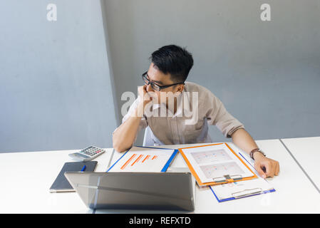 Young man thinking about solution for the problem Stock Photo